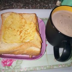 A picture of Buttered Egg Bread with Chocolate Tea.