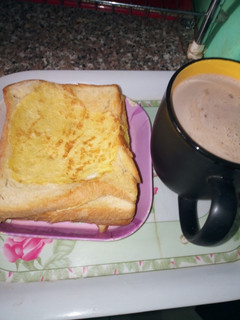 A picture of Buttered Egg Bread with Chocolate Tea.