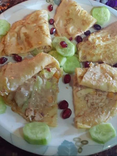 A picture of Eggs With Chicken and Veggies Filling.