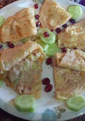 A picture of Eggs With Chicken and Veggies Filling.