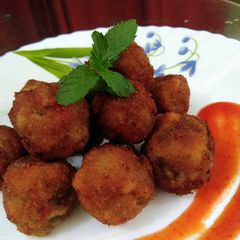 A picture of Stuffed cheesy mushroom balls.