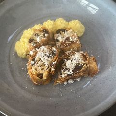 A picture of Rum Glazed Almond & Raisin Filo Roll with Rum Cream.