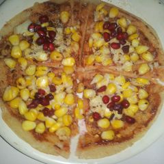 A picture of Dosa base corn chesse pizza.