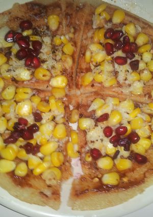 A picture of Dosa base corn chesse pizza.