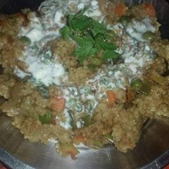A picture of Dalia upma with mint raita.