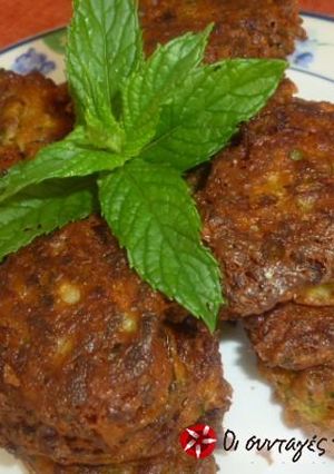A picture of Zucchini fritters with dill and feta cheese.