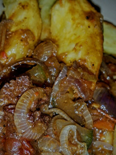 A picture of Fried sweet potatoes with beef sauce.