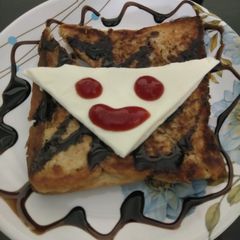 A picture of Cheese toast with smiley.