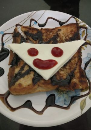 A picture of Cheese toast with smiley.