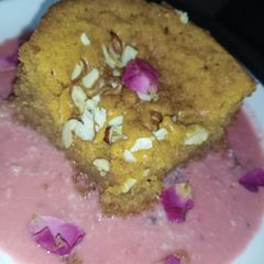 A picture of Mawa cake in rose flavoured rabri.