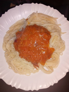 A picture of Spaghetti and homemade tomato sauce.