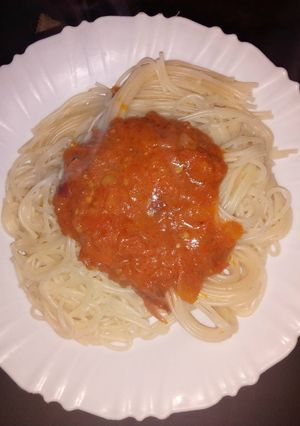 A picture of Spaghetti and homemade tomato sauce.
