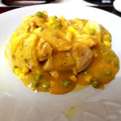 A picture of My Chip shop Curry with Chicken Over a Jacket Potato. 😃.