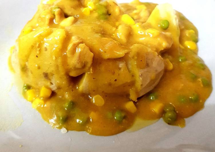 My Chip shop Curry with Chicken Over a Jacket Potato. 