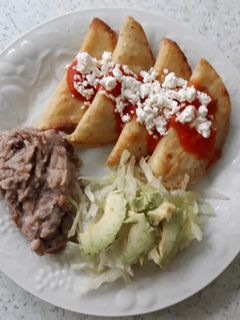 Una foto de Tacos dorados de queso