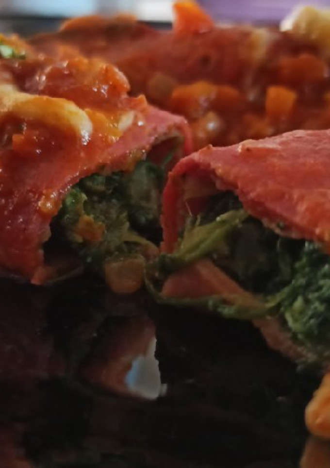 Una foto de Canelones con relleno de espinaca y salsa filetto