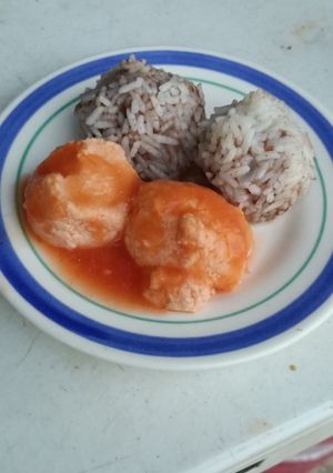 A picture of Egg in Salsa with Rice and Bean Balls.