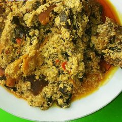 A picture of Egusi soup with goat meat.