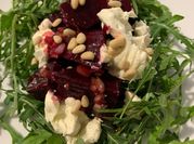A picture of arugula goat cheese salad