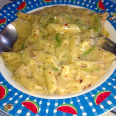 A picture of Penne Pasta in white sauce.