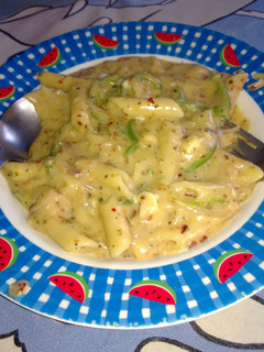 A picture of Penne Pasta in white sauce.