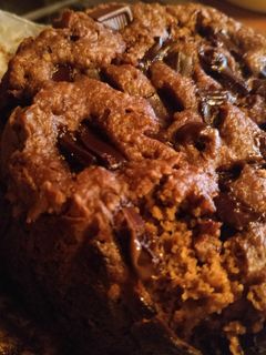 Una foto de Pastelito en taza de avena, plátano y chocolate