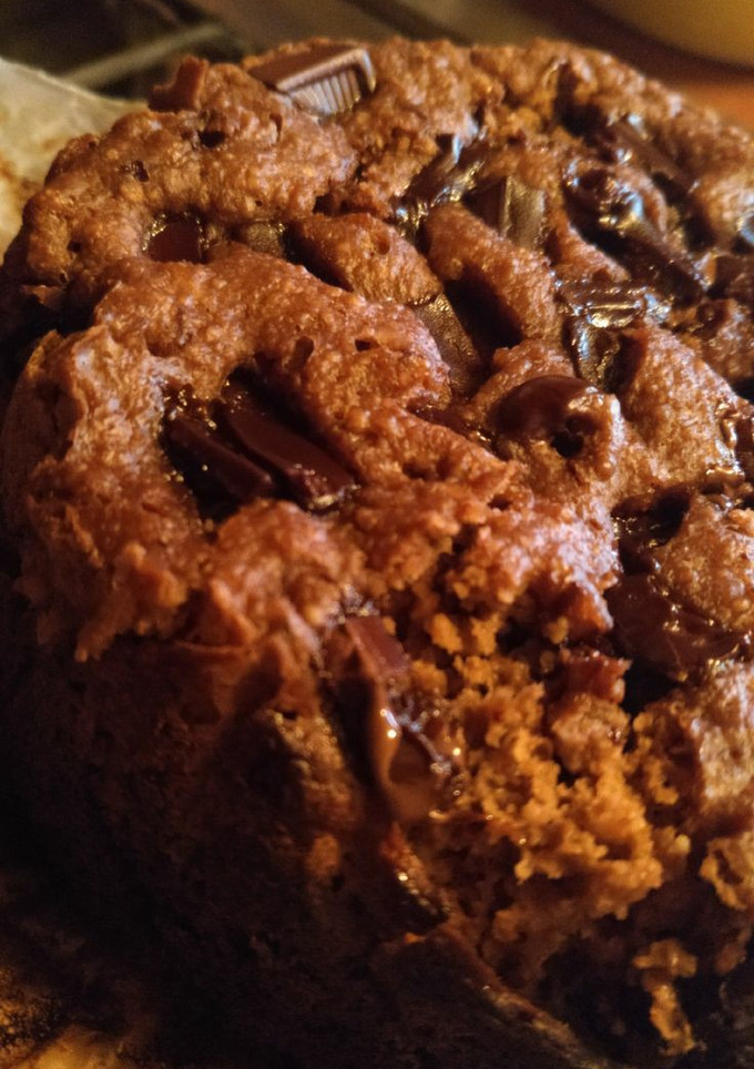 Una foto de Pastelito en taza de avena, plátano y chocolate