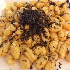 A picture of Black truffle ricotta gnocchi.