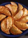 Empanadillas de sepia y patata al horno
