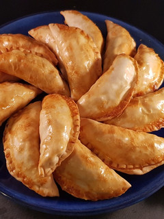 Una foto de Empanadillas de sepia y patata al horno