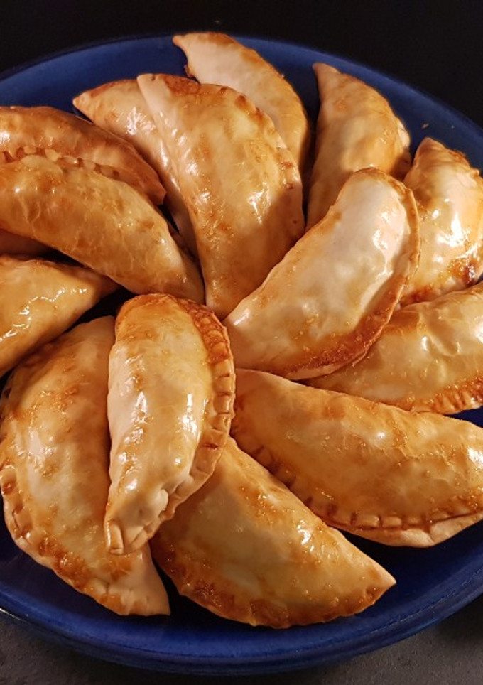 Una foto de Empanadillas de sepia y patata al horno