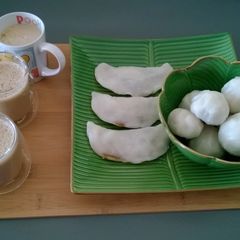 A picture of Kozhukatta/ Steamed rice dumplings with coconut-jaggery filling.
