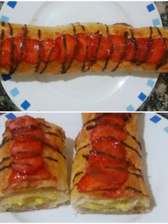 Una foto de Caña de hojaldre con crema y fresas