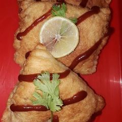 A picture of Fried chicken biriyani beignets.