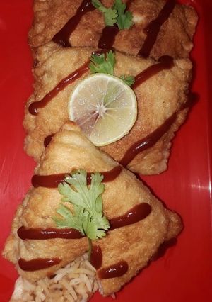 A picture of Fried chicken biriyani beignets.