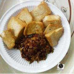 A picture of Awara (nigeriantofu) with egg and onion sauce.