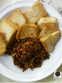 A picture of Awara (nigeriantofu) with egg and onion sauce.
