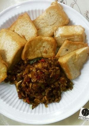A picture of Awara (nigeriantofu) with egg and onion sauce.