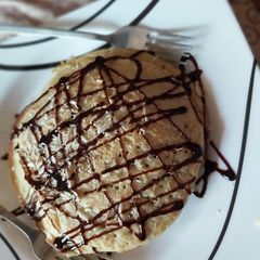 A picture of Pancake and crushed almonds.