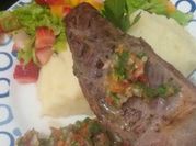 Una foto de bifes de chorizo a la parrilla