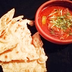 A picture of Aloo Chicken salan with Nan.