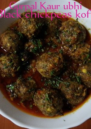A picture of Black chickpeas kofta curry 🍅🧅🌿🧄🌶️💧.