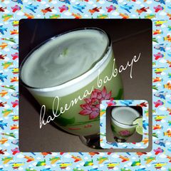 A picture of Mint leaf/ginger/lemon drink.