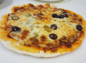 صورة لوصفة بيتزا على الصاج 👍😋