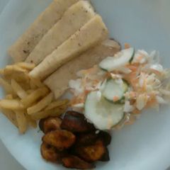A picture of Fried yam,irish and plantain with coleslaw.