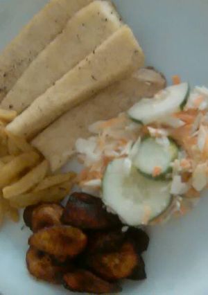 A picture of Fried yam,irish and plantain with coleslaw.