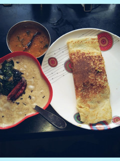 A picture of Masala Dosa with coconut chutney & sambhar.