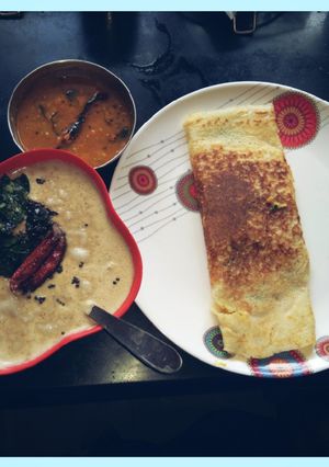 A picture of Masala Dosa with coconut chutney & sambhar.