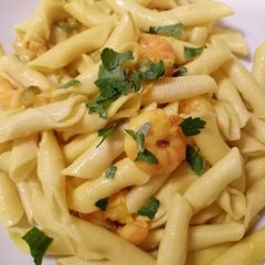 A picture of Garganelli with prawns, saffron and round courgette.