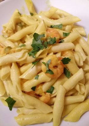 A picture of Garganelli with prawns, saffron and round courgette.